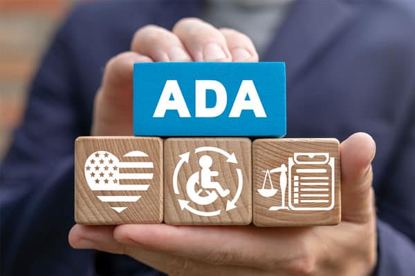 A man holding blocks with the word ada on them, representing a collection agency specializing in receivables.