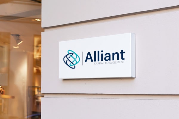 A sign displaying "Alliant" on the side of a building, emphasizing the company's strong reputation and effective marketing efforts.