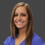 A smiling woman in a blue shirt, representing the brandingArc.