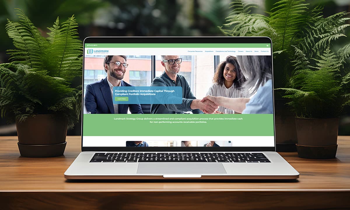 A business laptop showcasing a branded website on a sleek wooden table.